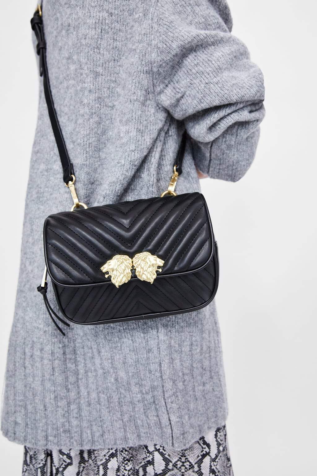 CROSSBODY BELT BAG WITH LION DETAILS